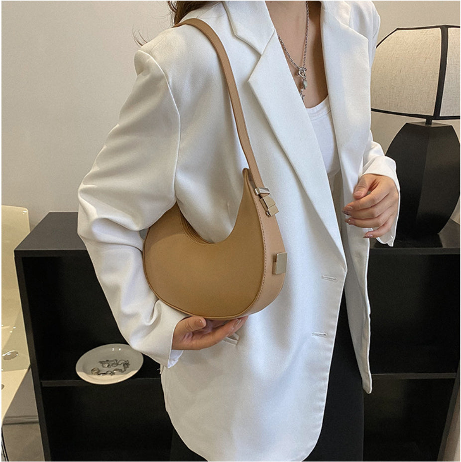 Minimalist Crescent Bag – Sculpted Elegance in Faux Leather